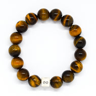 
MysticFlavia tiger eye infinity bracelet 12mm with silver charm, flat lay white background
