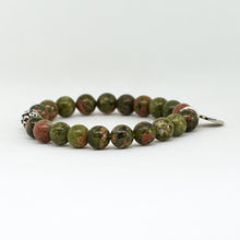 Load image into Gallery viewer, Low-angle view of Unakite Stone Silver Bead Bracelet 8MM highlighting natural green and pink gemstone beads with elegant silver bead accents.
