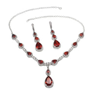 RRed gemstone silver necklace set displayed on a black jewelry bust with matching earrings