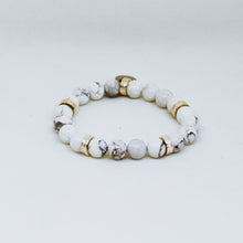 Load image into Gallery viewer, White howlite round bead bracelet with gold-tone roman flat silver spacer beads on white background


