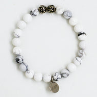 MysticFlavia white howlite stone silver bead bracelet with round charm, white background