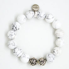 Load image into Gallery viewer, White howlite silver bead bracelet 12mm flat lay showing engraved silver bead detail and brand charm

