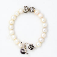 White Pearl Silver Toggle Clasp Bracelet with floral silver accents on a white background