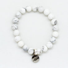 Load image into Gallery viewer, MysticFlavia white howlite flat silver bead bracelet with round charm, white background

