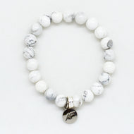 MysticFlavia white howlite flat silver bead bracelet with round charm, white background