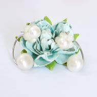 White pearl flower hoop earrings with blue floral background