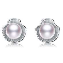 Load image into Gallery viewer, White pearl shell-shaped silver stud earrings on a white background
