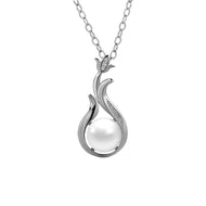 Flame-shaped pearl pendant necklace in silver, front view on white background.
