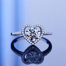 Load image into Gallery viewer, Radian Heart Solitaire MOISSANITE Silver Ring with heart-shaped center stone and reflective finish
