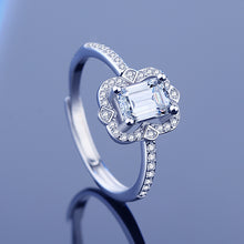 Load image into Gallery viewer, Emerald cut moissanite ring with sparkling halo and 925 sterling silver band | MysticFlavia
