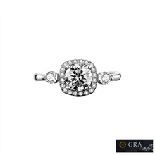 Load image into Gallery viewer, MysticFlavia moissanite ring close-up with round center stone and sparkling silver halo setting
