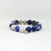 Load image into Gallery viewer, Angled view of Sodalite Matte Stone Silver Bead Bracelet 12MM with natural matte sodalite gemstones by MysticFlavia
